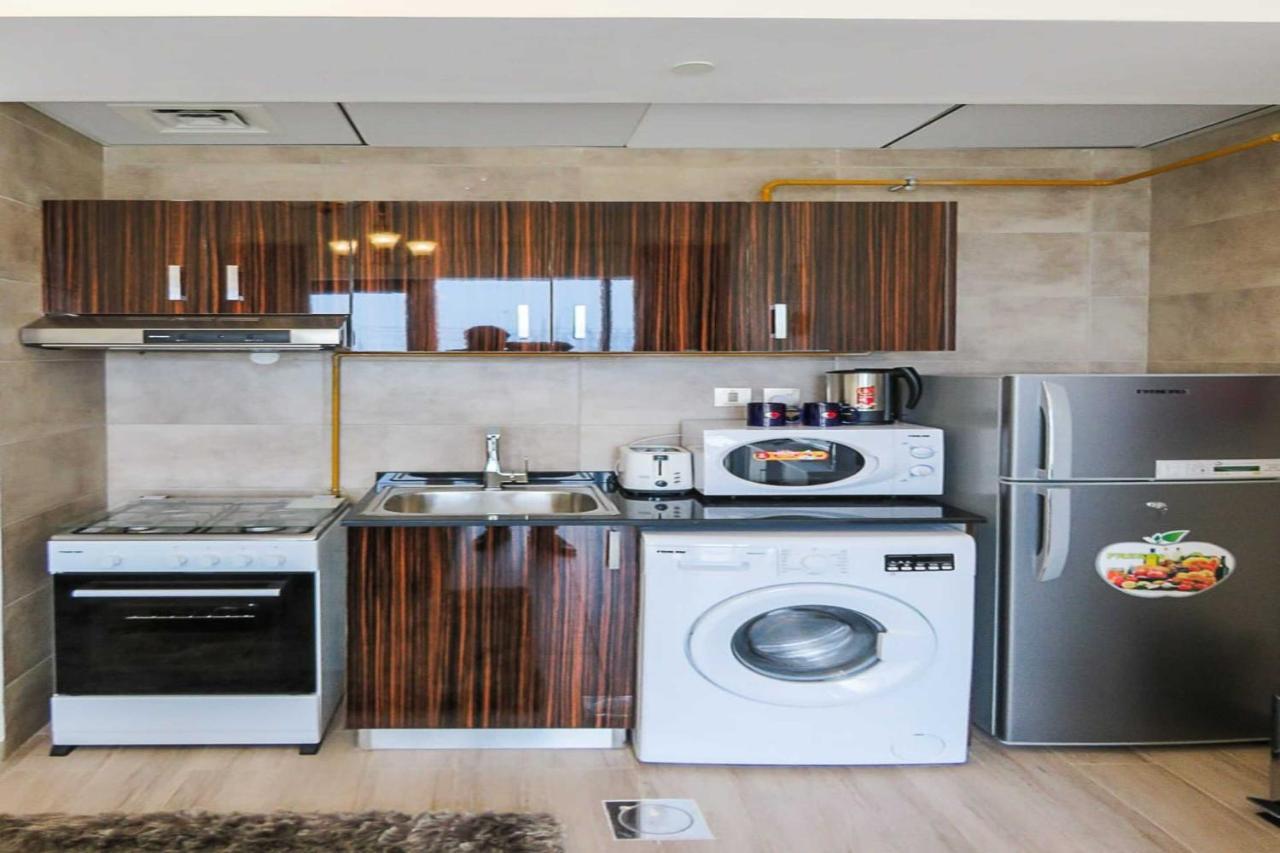 Oyo 860 Studio Apartment, Maya Tower 4, Jumeirah Village Triangle Dubai Exterior photo